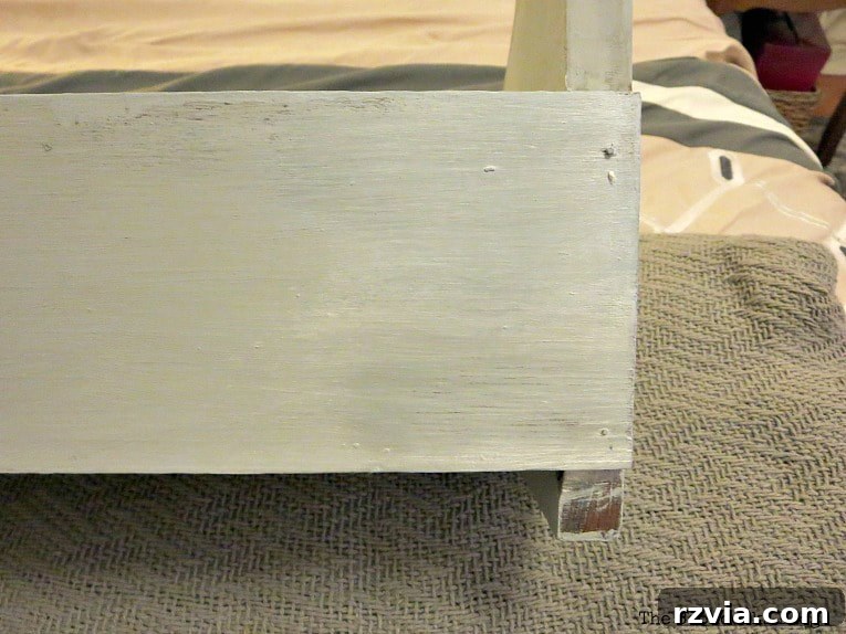 Comparison of two decorative waxes on the wood shelf, showing the subtle difference in shimmer and finish.