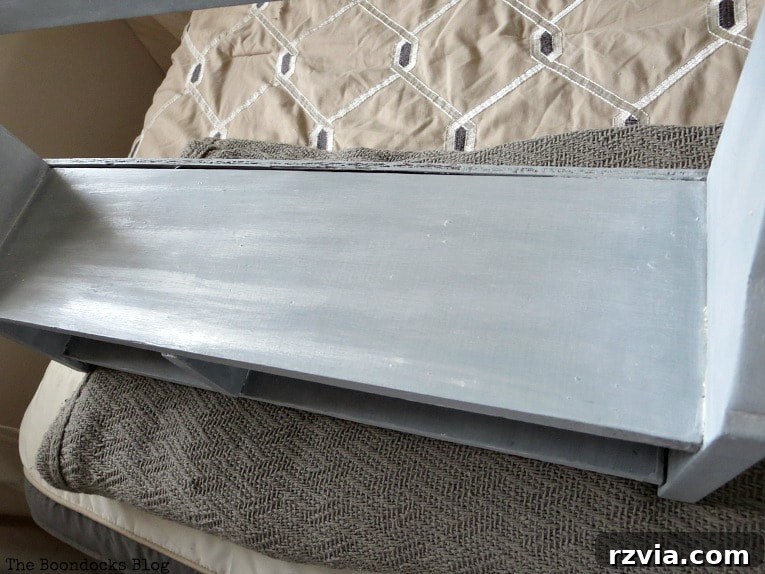 Top view of the wood shelf, with distinct strips of metallic shimmer applied, illustrating the shimmer effect.