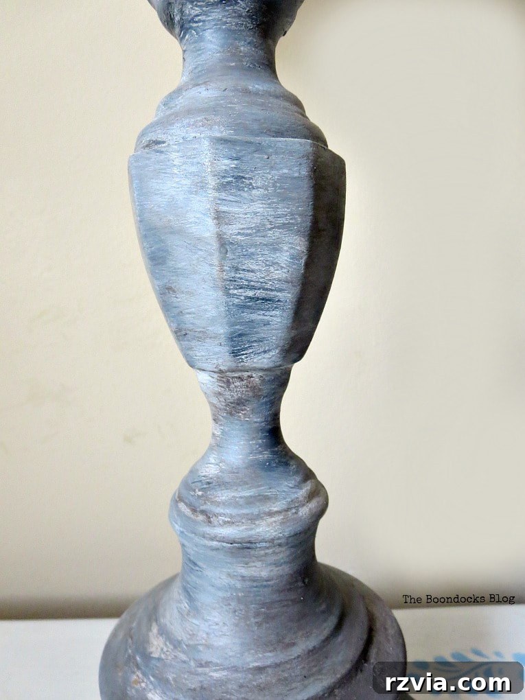 Give Your Lamp Base a High-End Stone Look 2 Close-up of a beautifully painted metal lamp base, now sporting a realistic faux stone finish. The texture and varying shades of grey create an authentic stone appearance, elevating the lamp's design.