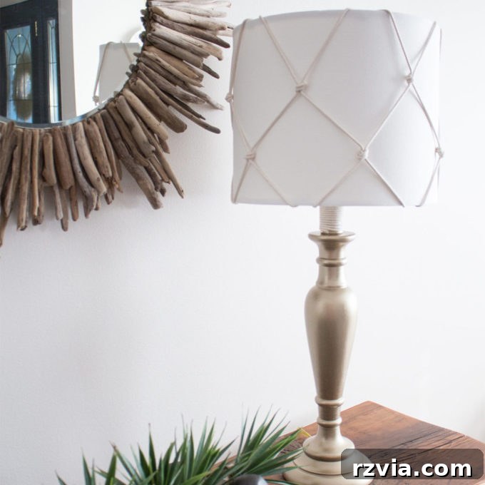 Give Your Lamp Base a High-End Stone Look 16 A stylish neutral lamp makeover featuring a burlap shade and a refined gold base, offering a sophisticated update. This image showcases a different approach to lamp painting ideas, blending natural textures with classic metallic accents for a versatile decor piece.