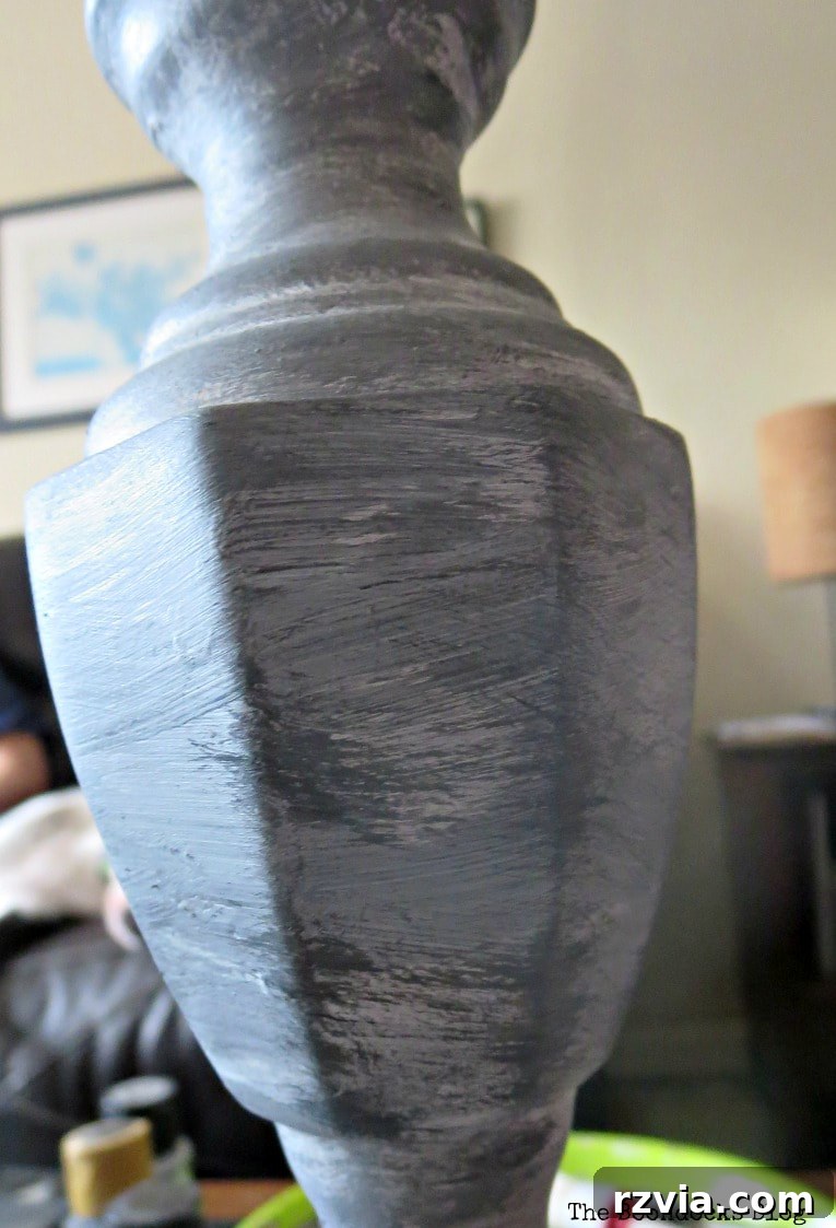 Give Your Lamp Base a High-End Stone Look 8 Close-up of the dry brushing process on the lamp base, showing a small amount of paint being delicately applied to create fine textures. The layered colors and subtle highlights are visible, showcasing the evolving stone-like surface.