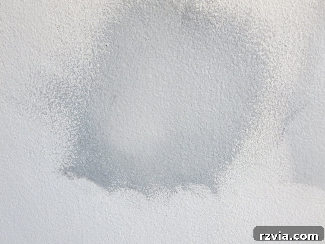 Create Your Own Dreamy Cloud Accent Wall 12 A section of the accent wall with two paint shades seamlessly blended, creating a convincing cloud illusion.