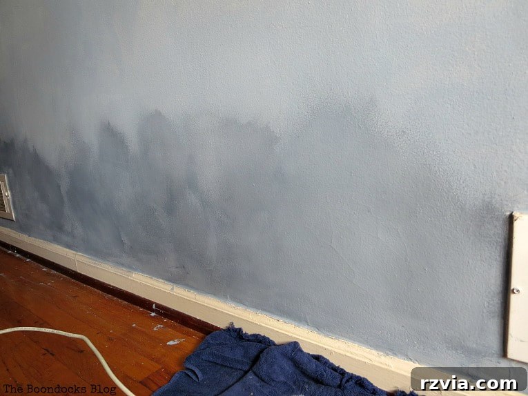 Create Your Own Dreamy Cloud Accent Wall 13 The bottom portion of the accent wall already shows the developing cloudy effect, providing a visual reference for further adjustments.