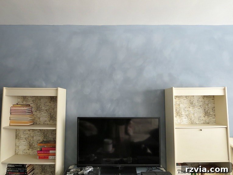 Create Your Own Dreamy Cloud Accent Wall 15 Two shelves and a TV stand thoughtfully placed in front of the newly painted accent wall, highlighting the subtle cloudy effect.
