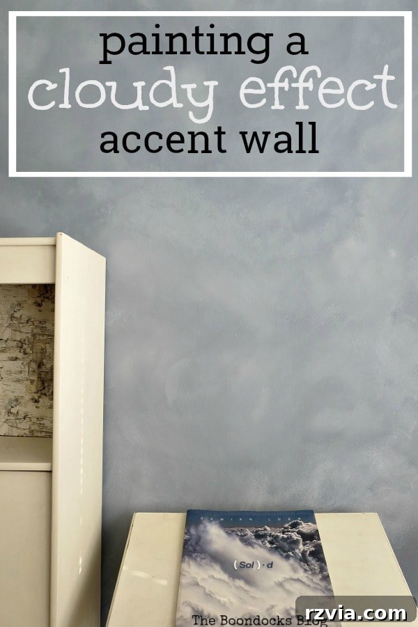 Create Your Own Dreamy Cloud Accent Wall 23 Pinterest graphic featuring the accent wall with a cloud effect, overlaid with text "Painting a Cloudy Effect Accent Wall."