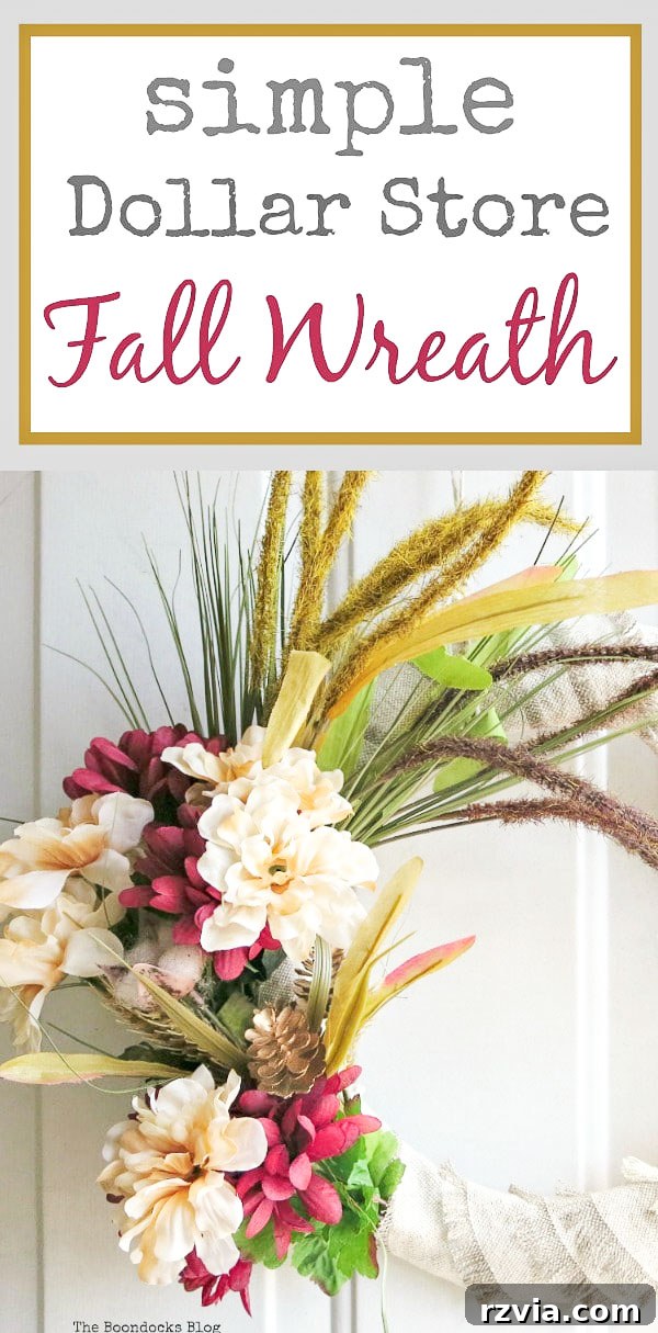 A vertical shot of the completed vibrant DIY dollar store fall wreath, showcasing its full autumnal glory on a door.
