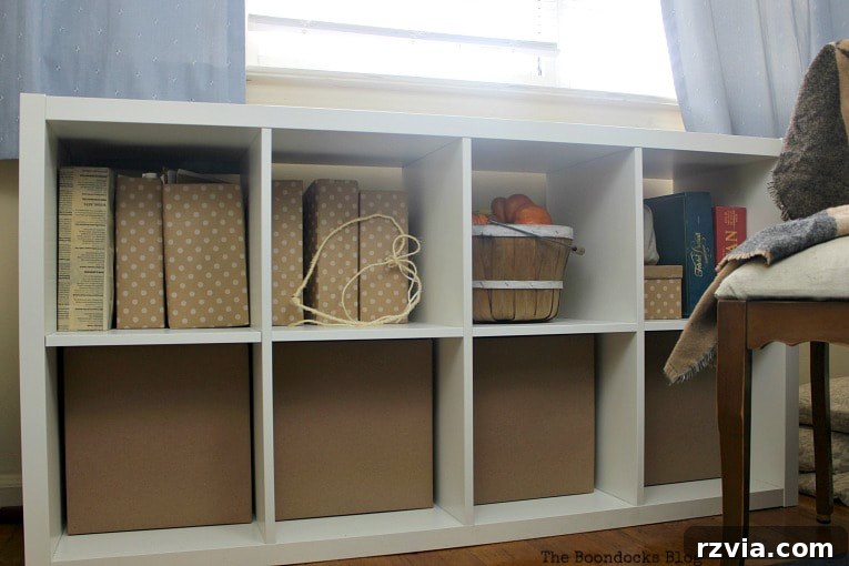 DIY Cardboard Desk Organizer 12 A Kallax storage unit fully assembled with the DIY cardboard paper boxes and a cozy basket, creating a harmonized storage system.
