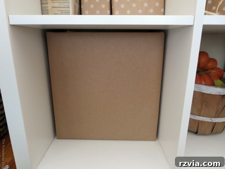 DIY Cardboard Desk Organizer 7 A close-up of a completed cardboard paper organizer storage cube, showcasing the smooth and neatly wrapped kraft paper surface.