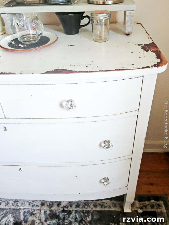 Jewel Your Furniture: Crystal Knobs for an Instant Upgrade 11 Tall shot of the white distressed vintage dresser with sparkling glass knobs, ideal for bedroom decor.