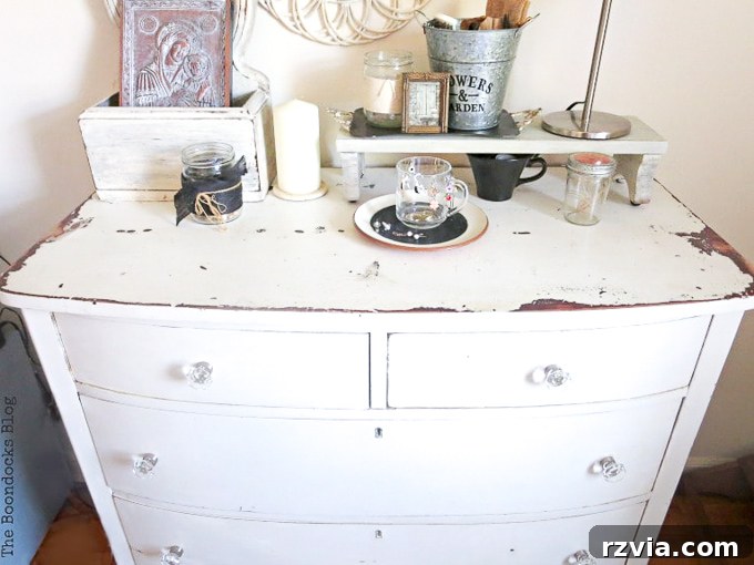 Jewel Your Furniture: Crystal Knobs for an Instant Upgrade 3 After Dresser Makeover: Elegant distressed white dresser with new crystal glass knobs, showcasing an aged sparkle.