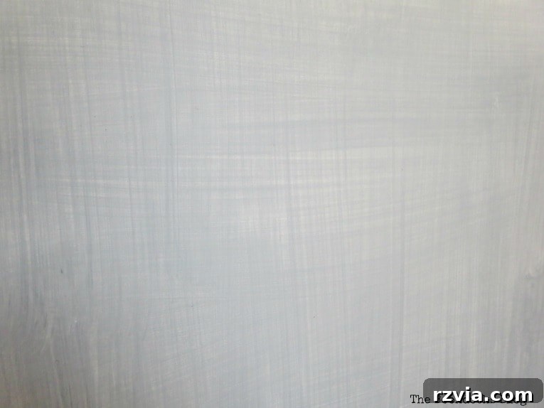 Close-up of dresser drawer front, showcasing the soft pattern created by alternating brush strokes in different directions.
