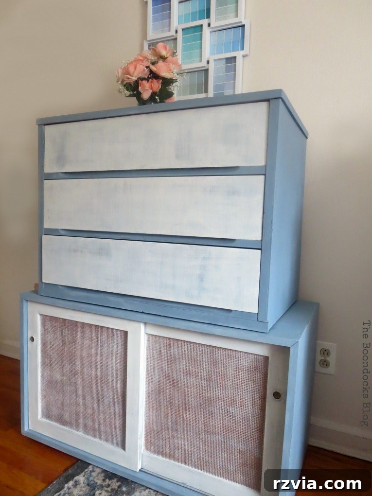 Final view of the unified MCM dresser and sideboard in white and slate, showing how the colors complement the existing decor, including a similar rug. Keywords: #DIYproject #Midcenturymodernfurniture #MCMfurniture #paintedfurniture #oldfashionedmilkpaint #milkpaint