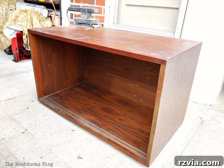 Close-up of the Mid Century Modern sideboard before its final transformation, showing the previous soft grey paint and contrasting elements.