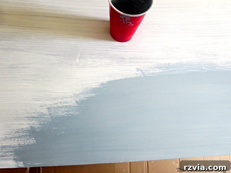 Sideboard painted in Snow White with a top coat of Slate milk paint, showing the smooth, even coverage and new color.