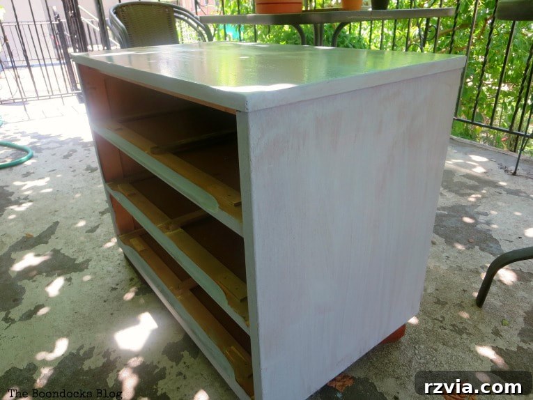 Mid Century Modern dresser after its first coat of Snow White milk paint, showing a clean, even base.