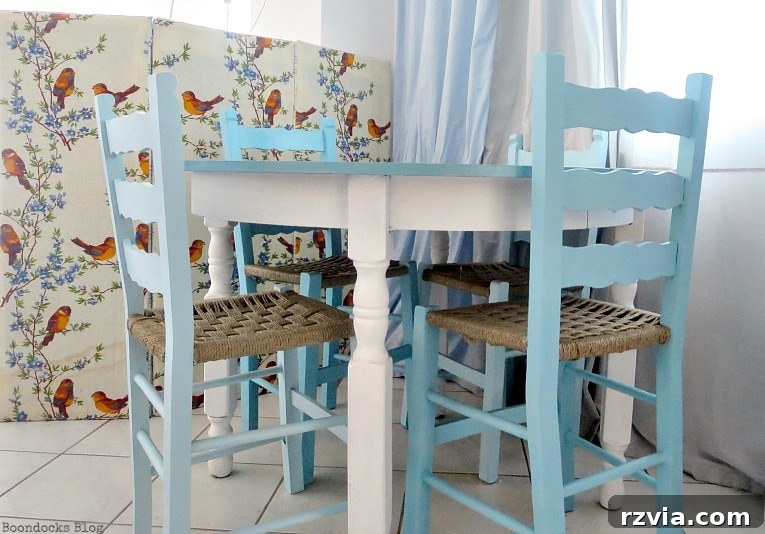 Revamp Your Wooden Chairs: Painting Made Easy 11 A dining area featuring a beach-themed table paired with the newly painted ombre blue chairs, creating a cohesive and bright coastal aesthetic indoors.
