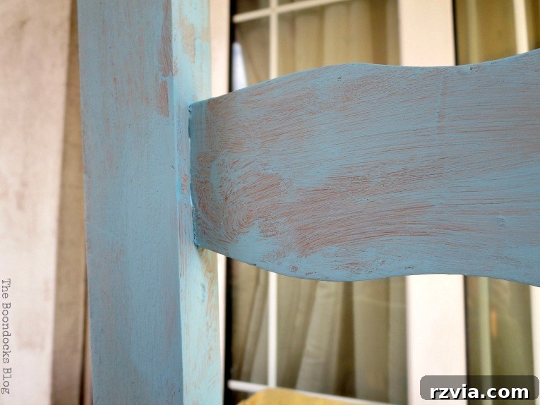 Revamp Your Wooden Chairs: Painting Made Easy 5 Wooden chair painted with one coat of blue chalk paint, showcasing the initial color application during a DIY furniture transformation project.