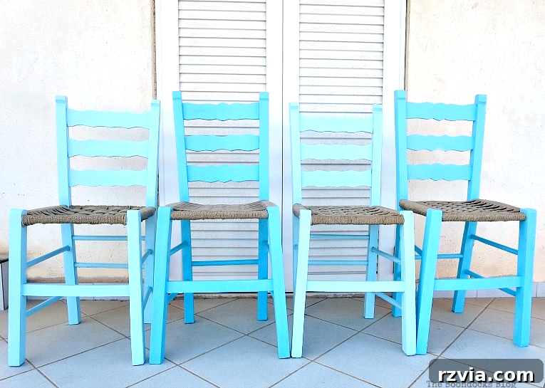 Revamp Your Wooden Chairs: Painting Made Easy 9 A playful arrangement of two blue painted dining chairs, positioned as if 'line dancing,' showcasing their vibrant ombre finish and inviting new life into a space.