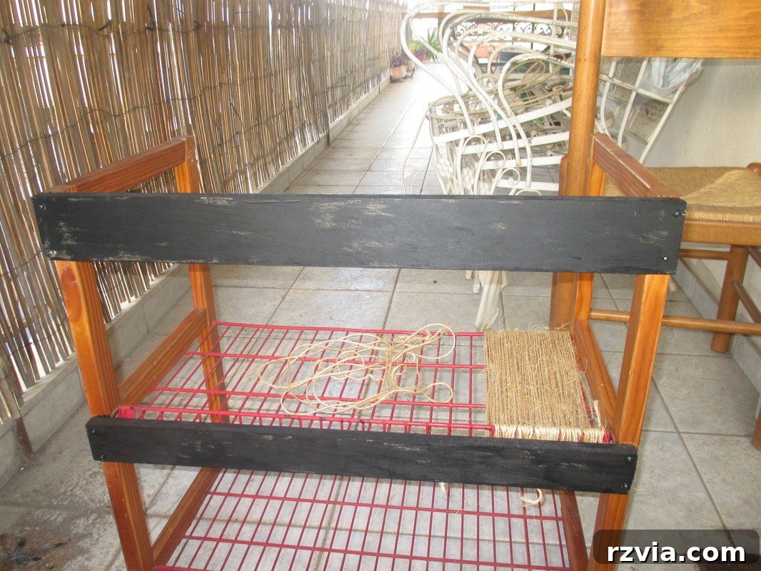painting the wood black, Storage Unit Upcycle www.theboondocksblog.com
