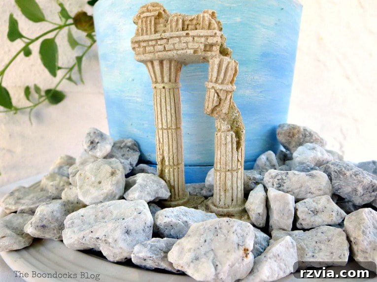 Seaside Style from Salvaged Treasures 12 Small decorative 'ruins' carefully positioned among the pebbles around the planter, adding an ancient, historical element to the beach vignette.