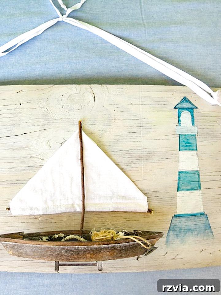Coastal Creations from Repurposed Finds 2 Finished DIY beach wall art crafted from upcycled items, featuring a sailboat and lighthouse