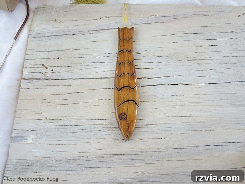 Coastal Creations from Repurposed Finds 7 A unique string of fish-shaped worry beads, repurposed for beach-themed artwork