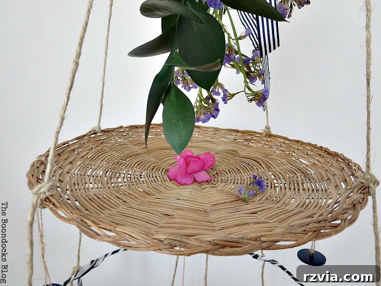 Beyond the Closet: Crafting Unique Mobiles from Wire Hangers 12 Flower bouquet hanging over the second tier of the mobile.