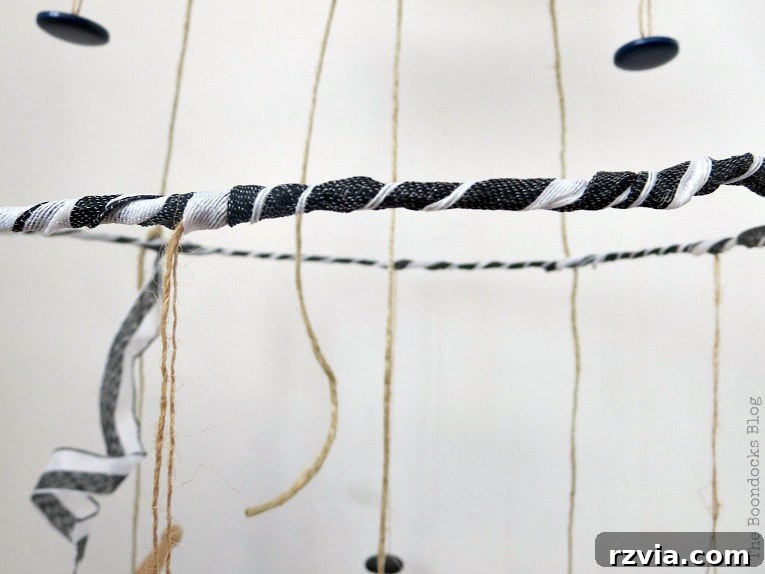 Beyond the Closet: Crafting Unique Mobiles from Wire Hangers 16 Close up of ribbon wrapped around the third tier mobile.