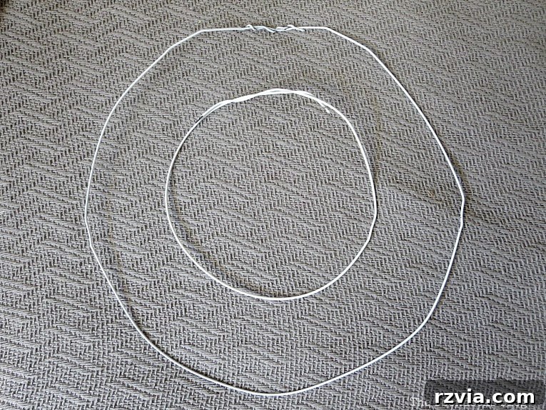 Beyond the Closet: Crafting Unique Mobiles from Wire Hangers 6 Shaping the wire hangers into circles.