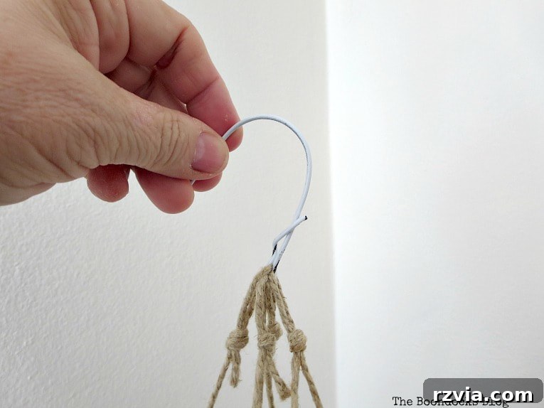Beyond the Closet: Crafting Unique Mobiles from Wire Hangers 7 Creating a hook from the top of the wire hanger.