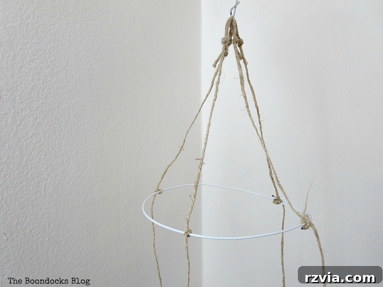 Beyond the Closet: Crafting Unique Mobiles from Wire Hangers 8 Making loops from the twine to make a mobile.