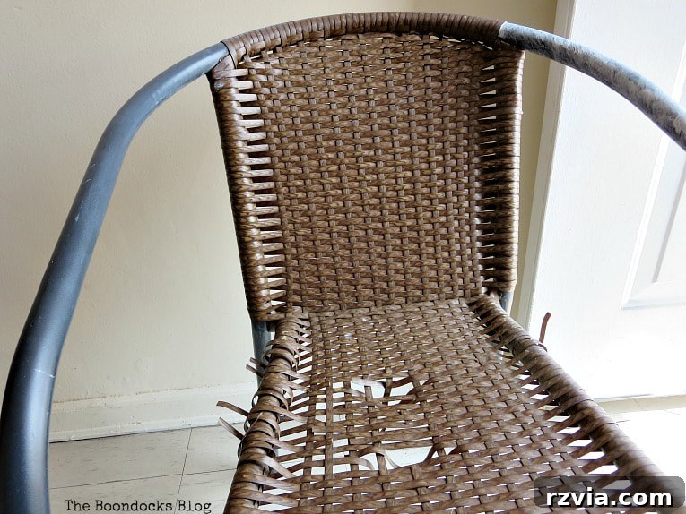Rattan Revival: Creative Ideas for Your Damaged Chair 3 A torn rattan chair, an ideal candidate for repurposing into charming outdoor decor.