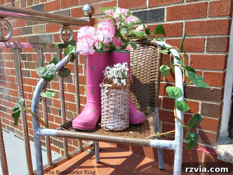 Rattan Revival: Creative Ideas for Your Damaged Chair 7 The rattan chair now featuring painted boots and a wicker bottle holder, creating a much improved display.