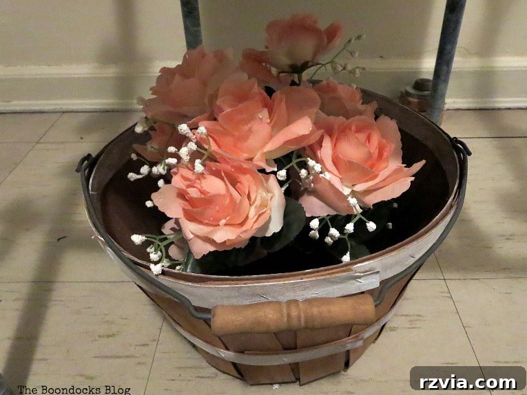 Rattan Revival: Creative Ideas for Your Damaged Chair 10 A basket filled with faux flowers, painted with white strips, ready to complete the outdoor decor vignette.