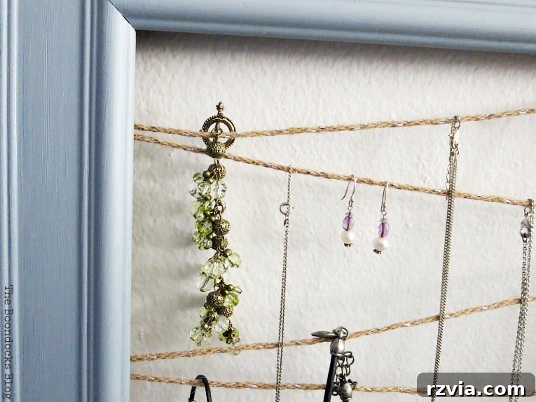 A wide shot of the elegant DIY jewelry organizer, showing its full design and capacity for holding numerous jewelry pieces efficiently in a stylish way.