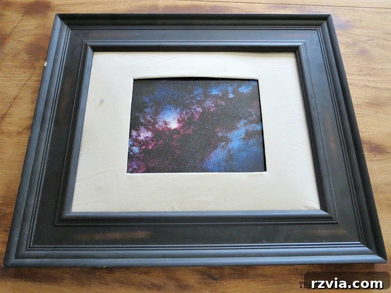 The large, old picture frame before its transformation into a DIY jewelry organizer. It's ready for a fresh coat of paint and repurposing.