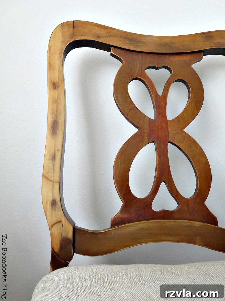 The finished wood chair showcasing a beautiful, distressed finish enhanced with Tung Oil, highlighting its natural character.