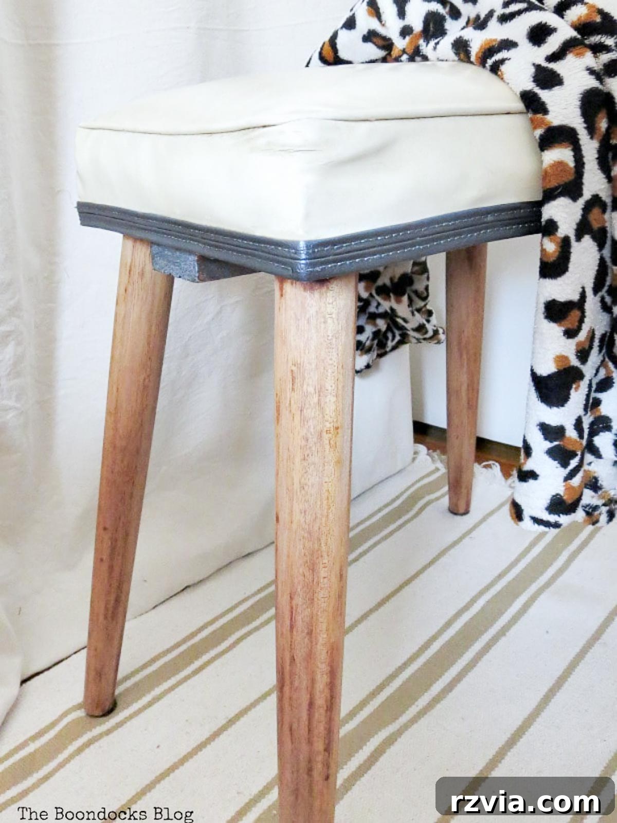 Another angle of the Mid-Century Modern stool after its transformation, highlighting vintage charm and refreshed details.