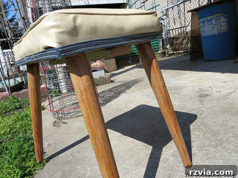 Sanded wooden legs of the Mid-Century Modern bench, revealing a natural honey finish and smooth texture.