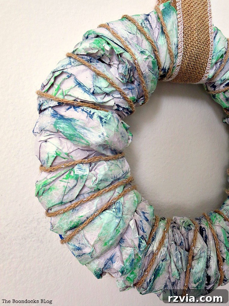 Bright Ideas Easy Colorful Packing Paper Wreath 15 A close-up view of an easy DIY wreath made with colorful packing paper, highlighting the intricate textures and varying shades created through the crafting process.