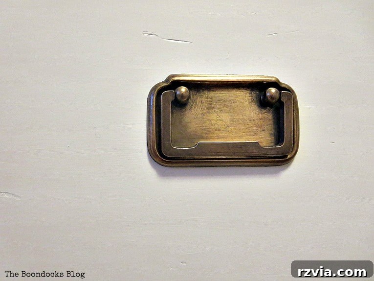 Bringing a Campaign Dresser Back to Life 7 Close-up view of the restored brass handles, exhibiting a refreshed yet characterful patina.