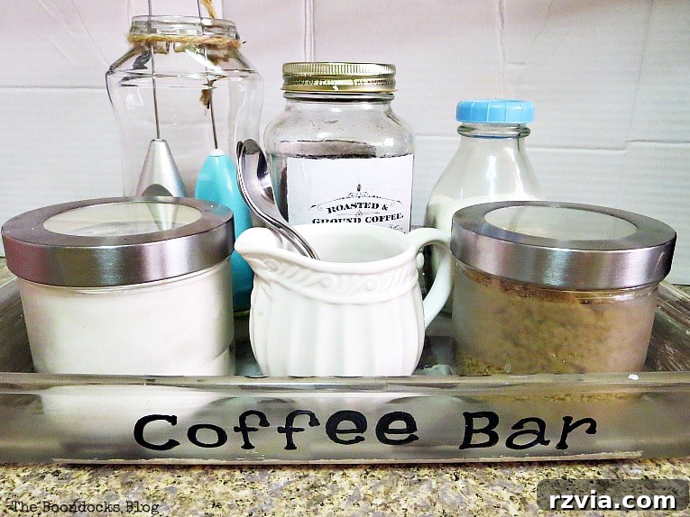 Crafting Your Charmingly Casual Coffee Nook 2 Organized coffee bar station filled with jars, sugar, and coffee on a kitchen counter.