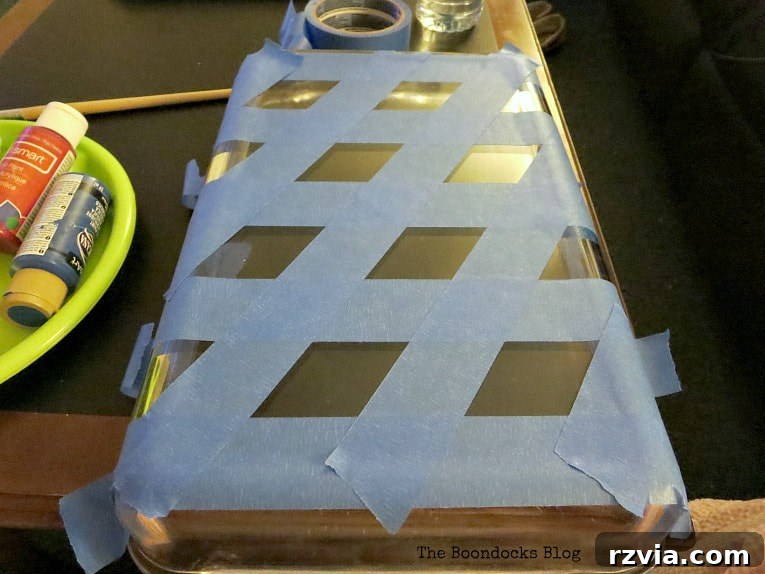 Crafting Your Charmingly Casual Coffee Nook 5 Applying masking tape to a glass tray to create a geometric pattern for painting.