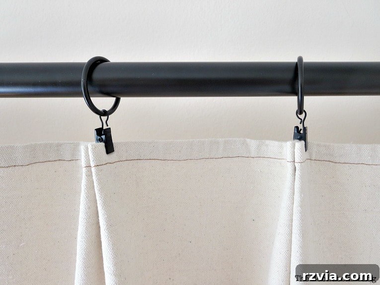 Crafting Elegant Pleated Curtains from Humble Drop Cloths 14 Close-up of the pleats created with clip rings on the drop cloth curtain, showing the neat folds and texture.
