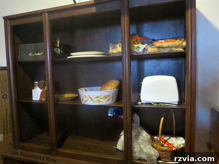 Revitalize Your MCM China Cabinet 14 The upper section of the cabinet, now repurposed for storage, showcasing the need for an opaque door solution.