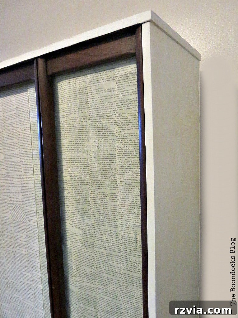 Revitalize Your MCM China Cabinet 16 The side of the upper cabinet, now elegantly painted white, contributes to the unified and modern aesthetic of the entire piece.