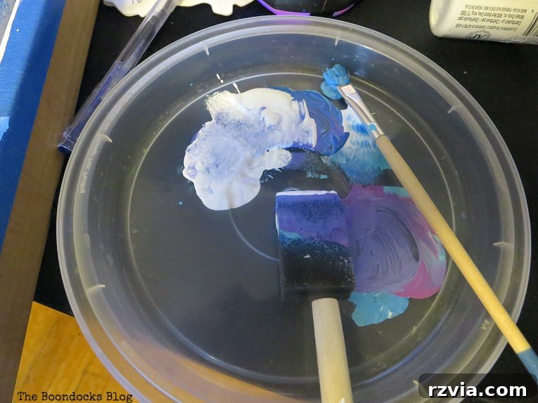 Impressionism Made Simple: A Painting Tutorial 5 Essential acrylic paints and brushes laid out for an Impressionist art project