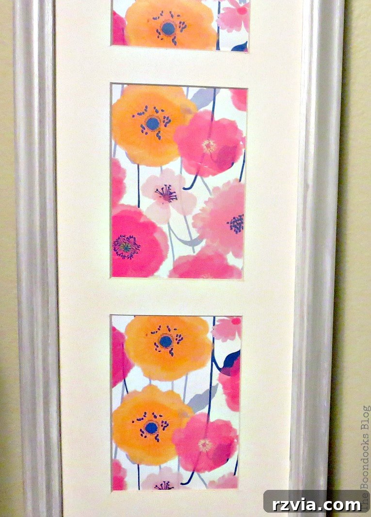 Your Home's Instant Spring Art Makeover 2 Flower wrapping paper placed inside a frame to make instant spring artwork.