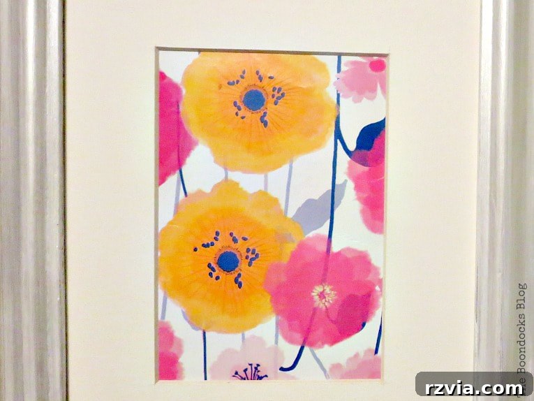 Your Home's Instant Spring Art Makeover 3 Close up of the beautiful floral wrapping paper placed inside the picture frame, creating stunning spring decor.