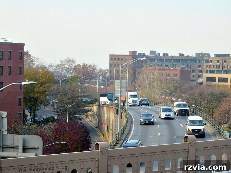 A panoramic view from the Brooklyn Bridge walkway showing the historic brownstones and charming streets of the Brooklyn Heights area. A Tour of the Astonishing Brooklyn Bridge Walkway.